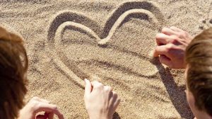A couple on a anniversary date at the beach